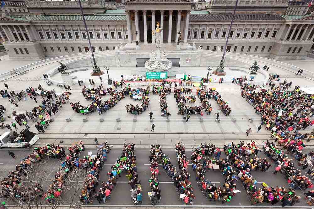 Protestors Spell Out Systems Change taken from above