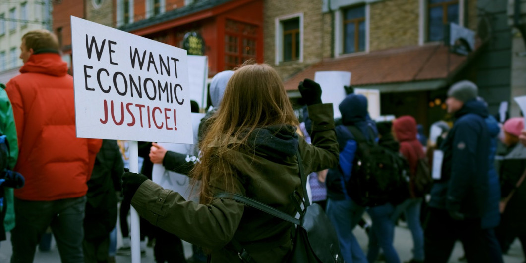 We want economic justice protest sign