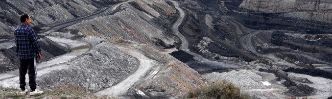 Man in front of a coal mine